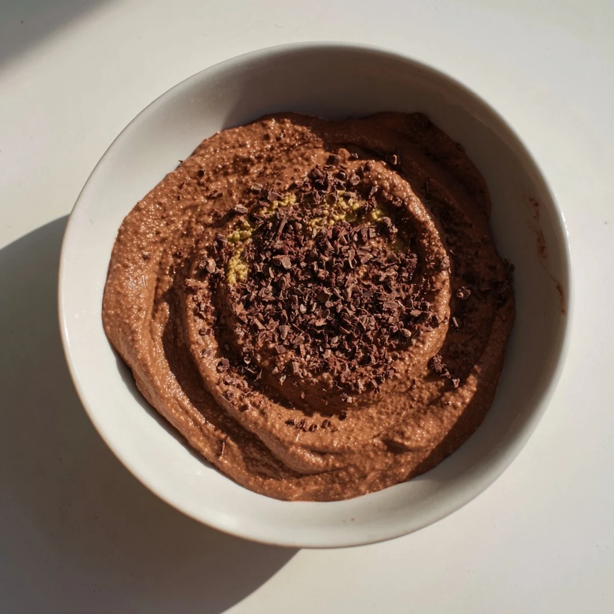 Dark chocolate shavings and creamy 5-Minute Chocolate Avocado Mousse create a decadent, dairy-free dessert.