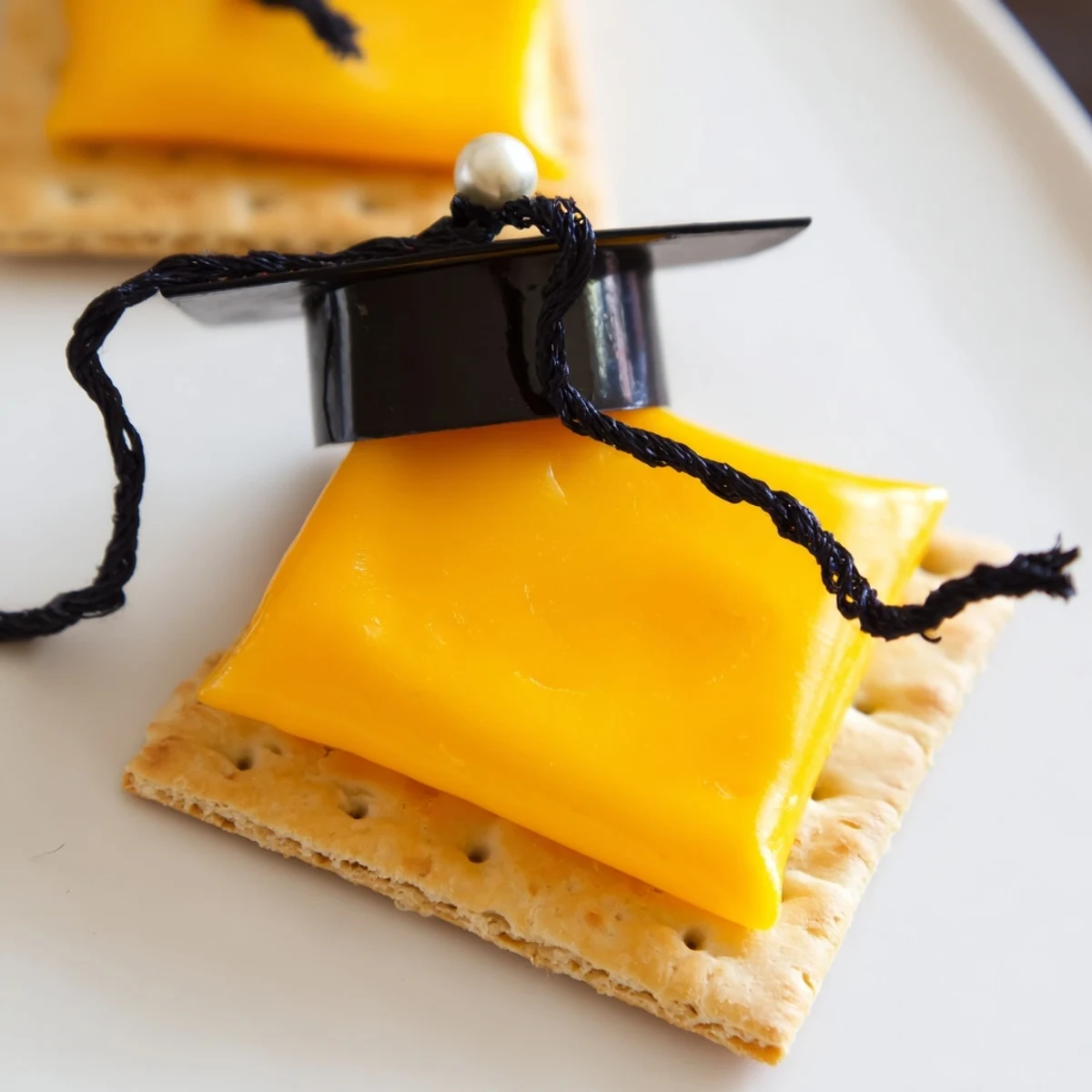 Freshly assembled Graduation Cap Snacks with colorful tassels, ready for serving at a party.