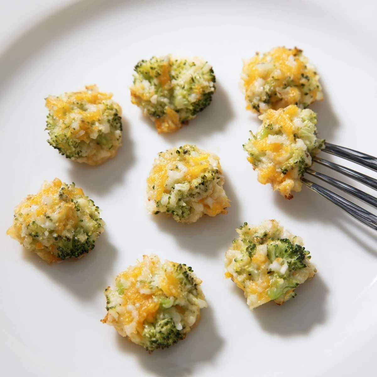 Close-up of savory Cheesy Broccoli Casserole Bites, perfect appetizers with a crispy, golden-brown crust.
