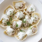 A plate of freshly cooked Russian Pelmeni, savory meat dumplings, perfect served hot.