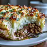Turkey Shepherds Pie with creamy cauliflower mash and savory ground turkey filling, baked until golden and bubbling.