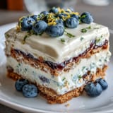Savor this no-bake Lemon Blueberry Icebox Cake, perfectly layered with zesty cream and sweet berries.
