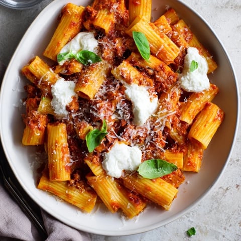 Slow cooker baked ziti bubbling with melted mozzarella and rich marinara sauce, perfect for family dinners.