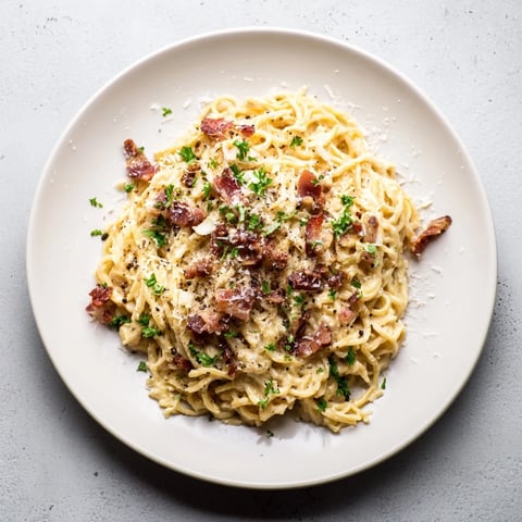 Creamy Instant Pot Carbonara Ramen, featuring perfectly cooked noodles and smoky bacon crumbles.