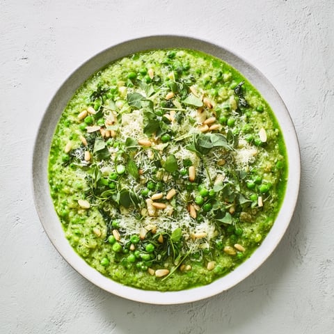 A beautiful bowl of Green Pea & Spinach Pasta, vibrant green sauce coats the protein pasta expertly.