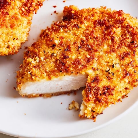 Golden air fryer chicken cutlets, perfectly crispy and ready to serve with lemon wedges, a delicious main.