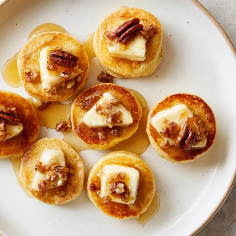 Golden-brown Pancake Brie Bites, a delightful appetizer with warm, melted brie inside.