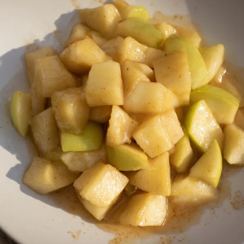 Slow cooker stewed apples bubbling gently, a perfect breakfast or dessert topping scented with cinnamon.
