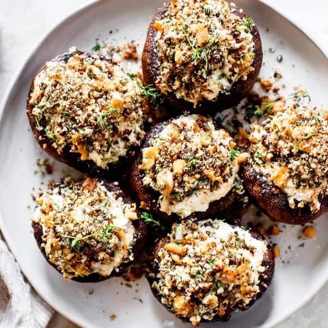 Savory Stuffed Mushroom Caps appetizer, baked and filled with herbs, perfect for sharing and easy to make.
