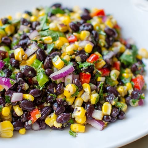 Close-up image of a vibrant Cowboy Caviar Salad, perfect for a refreshing vegan lunch or appetizer.
