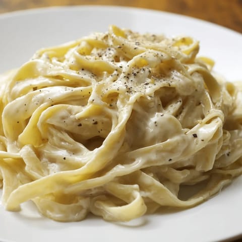 Creamy and simple, this Lazy Girl Three-Ingredient Pasta features rich butter sauce coating the noodles.