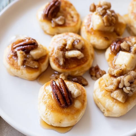 Enjoy these sweet-savory Pancake Brie Bites, perfect for brunch, baked until bubbly and golden.