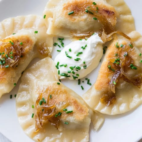 Imagine the soft, pillowy texture of these Polish pierogi, filled with creamy cheese and potato.