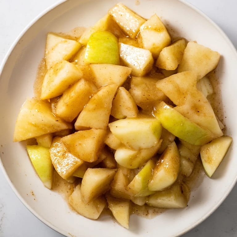 Warm, sweet Slow Cooker Stewed Apples, a fall comfort food with honey and tender, spiced apples.