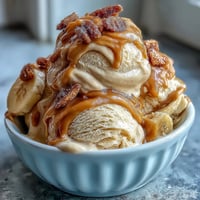 Creamy peanut butter banana ice cream with swirls of rich nut butter and natural sweetness.  