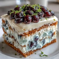 Lemon Blueberry Icebox Cake: tangy lemon cream meets bursting blueberries in a chilled graham cracker dream.